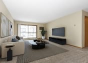 Thumbnail 4 of 29 - a living room with a couch and a coffee table. Anoka, MN Dellwood Estates