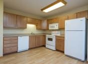 Thumbnail 12 of 21 - a kitchen with white appliances. Fargo, ND Crossroads Apartments