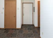 Thumbnail 11 of 13 - an entry door with a closet. Fargo, ND White Ridge Apartments