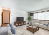 Thumbnail 1 of 6 - Bismarck, ND Arbor 400 a living room with white couches and chairs and a large window