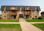 Thumbnail 16 of 16 - Bismarck, ND Eastbrook Apartments. Exterior of a three level apartment building