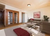 Thumbnail 1 of 4 - Bismarck, ND Mason Apartment. a studio apartment with a living room with a couch and a coffee table and a bed