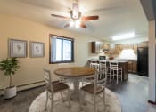 Thumbnail 3 of 10 - a dining room with a table and chairs. Bismarck, ND Newgate Apartments