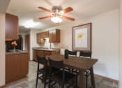 Thumbnail 2 of 6 - Kitchen and Dining Area at Parkview Arms Apartments in Bismarck, ND
