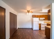 Thumbnail 11 of 17 - Bismarck, ND Rosser Apartments. a dining room with a closet and ceiling fan