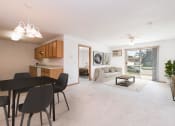 Thumbnail 6 of 16 - Sierra Ridge Apartments in Bismarck, ND | The space features an open floor plan with comfortable seating, a well-appointed dining table, and tasteful decor. The sliding glass door brightens the room w