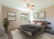 Thumbnail 7 of 11 - Bismarck, ND Stonefield Townhomes.The room features a comfortable bed, stylish furnishings, and a warm color palette, creating a relaxing atmosphere. The window fills the room with bright natural light.