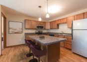 Thumbnail 3 of 16 - Kitchen Island at Stonefield Apartments in Bismarck, ND