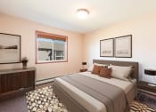 Thumbnail 4 of 16 - Comfortable Bedroom at Stonefield Apartments in Bismarck, ND