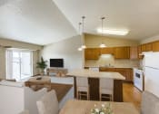 Thumbnail 7 of 20 - Living Room and Kitchen Area at Sunset Ridge Apartments in Bismarck, ND