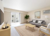 Thumbnail 3 of 20 - Bright Living Room at Sunset Ridge Apartments in Bismarck, ND
