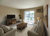 Thumbnail 1 of 20 - Spacious Living Area at Sunset Ridge Apartments in Bismarck, ND