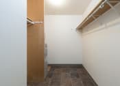 Thumbnail 6 of 7 - Bismarck, ND Bradbury Apartment. A small laundry room with a washer and dryer