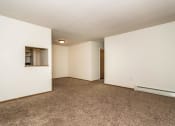 Thumbnail 7 of 19 - Grand Forks, ND Bristol Park Apartments. a bedroom with white walls and carpet