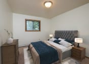 Thumbnail 9 of 18 - a bedroom with a large bed and a window. Fargo, ND Cedars 2 Apartments