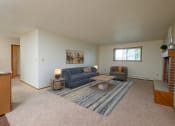 Thumbnail 7 of 18 - a living room with couches and a coffee table. Fargo, ND Cedars 2 Apartments
