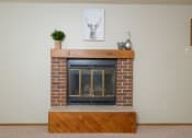 Thumbnail 12 of 13 - the fireplace in the living room. Fargo, ND Cedars 2 Apartments