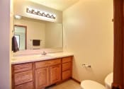 Thumbnail 18 of 20 - A bathroom with a sink and toilet.
