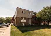 Thumbnail 18 of 19 - Grand Forks, ND Cherry Creek Apartments. Exterior with trees