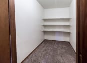 Thumbnail 11 of 19 - Grand Forks, ND Cherry Creek Apartments. A storage closet in  the unit 223 with shelves