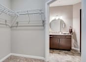 Thumbnail 67 of 83 - a closet in a bathroom with a sink and a mirror. Circle Pines, MN Lexington Lofts