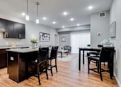 Thumbnail 63 of 83 - a kitchen and dining room with a table and chairs. Circle Pines, MN Lexington Lofts