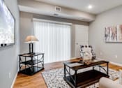 Thumbnail 52 of 83 - a living room with a couch and a table.  Circle Pines, MN Lexington Lofts