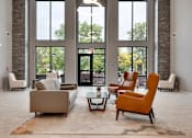 Thumbnail 70 of 83 - a living room with couches chairs and a table. Circle Pines, MN Lexington Lofts