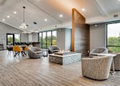 Thumbnail 77 of 83 - a living room with chairs and a fire pit. Circle Pines, MN Lexington Lofts