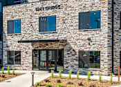 Thumbnail 80 of 83 - the front of our grocers building with a glass door. Circle Pines, MN Lexington Lofts