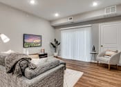 Thumbnail 33 of 83 - a living room with a couch and a chair. Circle Pines, MN Lexington Lofts