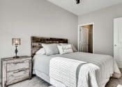Thumbnail 7 of 83 - a bedroom with a bed and a closet. Circle Pines, MN Lexington Lofts