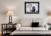 Thumbnail 2 of 83 - a living room with a couch and a table with lamps. Circle Pines, MN Lexington Lofts