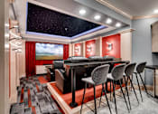 Thumbnail 72 of 83 - a bar in a room with a table and chairs. Circle Pines, MN Lexington Lofts