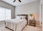 Thumbnail 24 of 83 - a bedroom with a bed and a window. Circle Pines, MN Lexington Lofts
