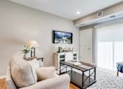 Thumbnail 22 of 83 - a living room with a couch and a chair. Circle Pines, MN Lexington Lofts