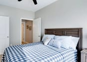 Thumbnail 19 of 83 - a bedroom with a bed and a closet. Circle Pines, MN Lexington Lofts