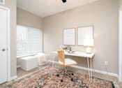Thumbnail 13 of 83 - a home office with a desk and a window. Circle Pines, MN Lexington Lofts
