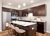 Thumbnail 11 of 83 - full kitchen with stainless steel appliances and granite counter tops. Circle Pines, MN Lexington Lofts
