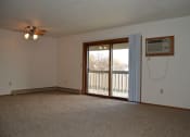 Thumbnail 2 of 6 - a living room with a carpeted floor and a large window