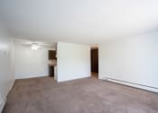 Thumbnail 6 of 14 - an empty living room with white walls and carpet. Coon Rapids, MN Robinwood Apartments