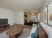 Thumbnail 4 of 23 - the view of a living room with a couch and a tv. Fargo, ND Countryside Apartments