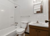 Thumbnail 8 of 9 - West St. Paul, MN Covington Courts Apartments. A bathroom with a sink toilet and bathtub