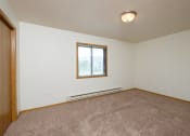 Thumbnail 8 of 11 - a bedroom with carpet and a window