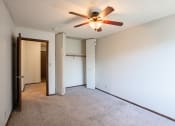 Thumbnail 28 of 42 - the living room of an empty apartment with a ceiling fan.   Eagan, MN Glen Pond Apartments