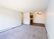 Thumbnail 23 of 42 - an empty living room with carpet and a ceiling fan.  Eagan, MN Glen Pond Apartments