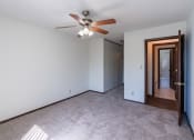 Thumbnail 20 of 42 - a bedroom with white walls and a ceiling fan. Eagan, MN Glen Pond Apartments