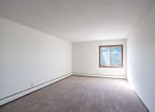 Thumbnail 13 of 42 - a blank room with carpet and a window. Eagan, MN Glen Pond Apartments