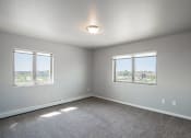 Thumbnail 7 of 25 - a bedroom with two windows. Fargo, ND 29 West Apartments
