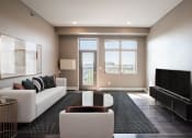 Thumbnail 3 of 25 - a living room with a white couch and a rug and a television. Fargo, ND 29 West Apartments